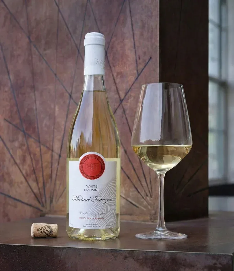 Sauvignon Blanc poured beside a window