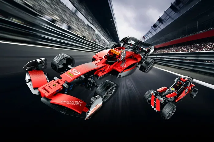 Red F1 racing car build speeding along a blurred racetrack